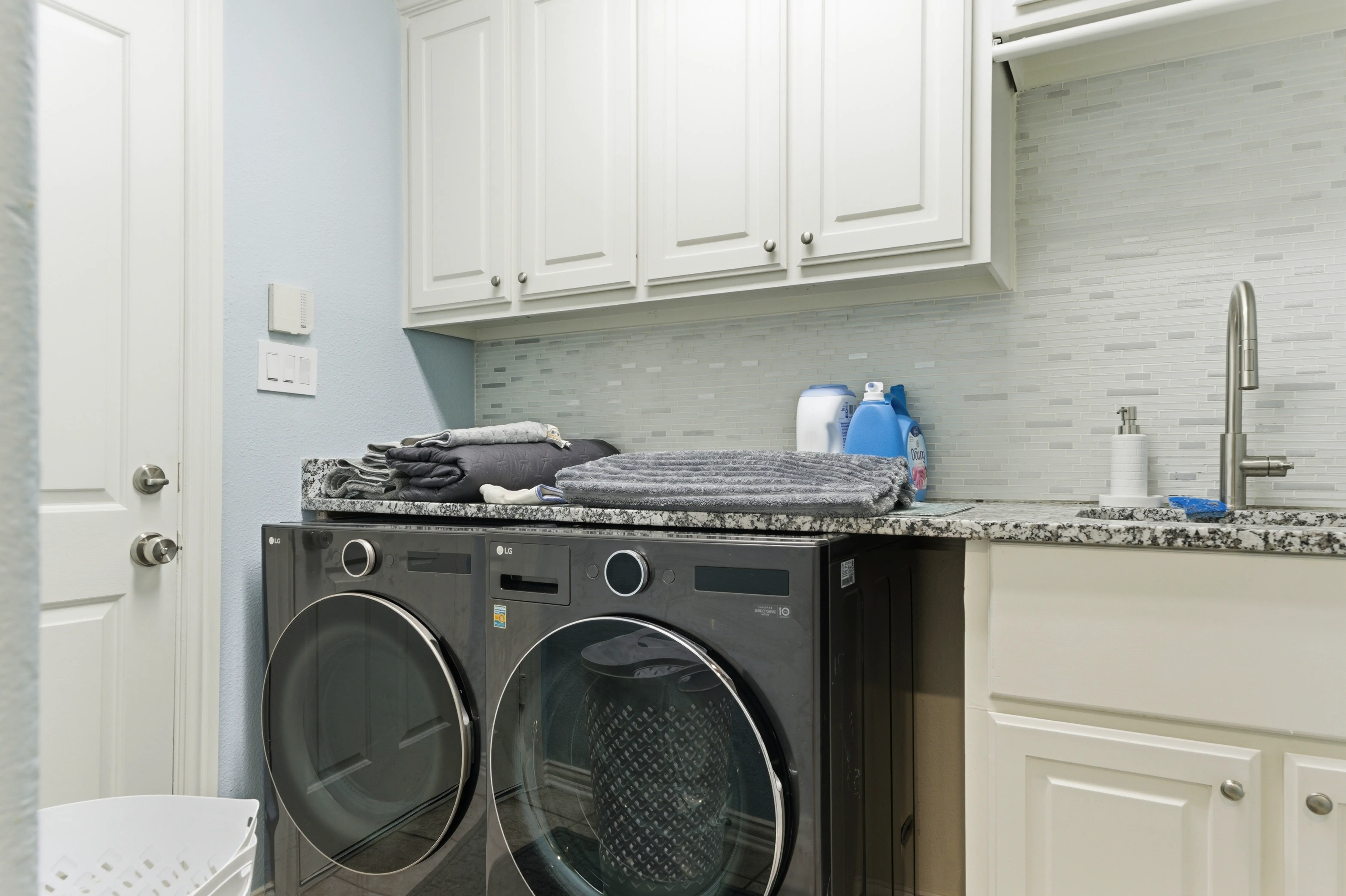 Laundry room with built-in cabinets
